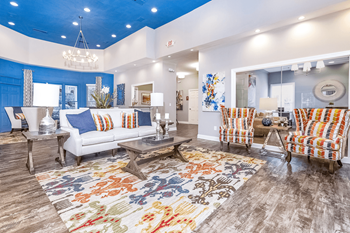 a spacious living room with a blue ceiling and white walls at Elan at Mallard Creek Apartment Homes, Charlotte, NC
